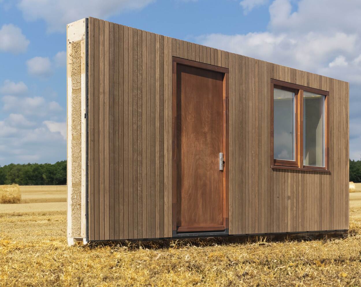wooden facade in a field of hay