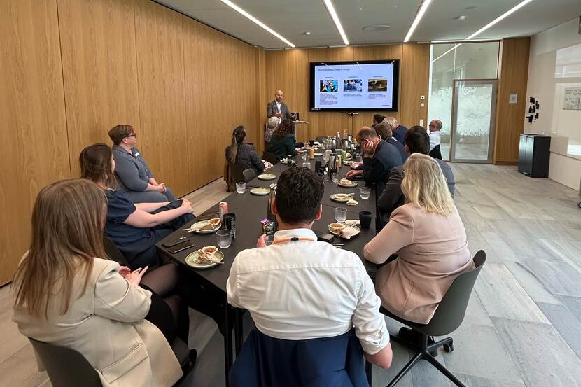 participants sitting at a table watching a presentation during Novonesis in May 2025