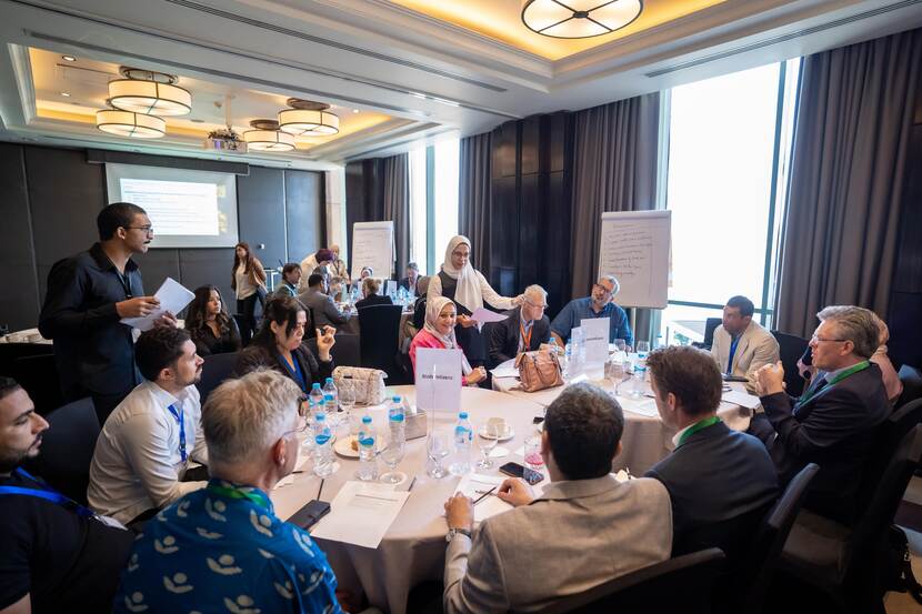 a focus group with representitives from PUM, SMEs and Chemonics gathered around 2 round tables at the Waste to Value forum