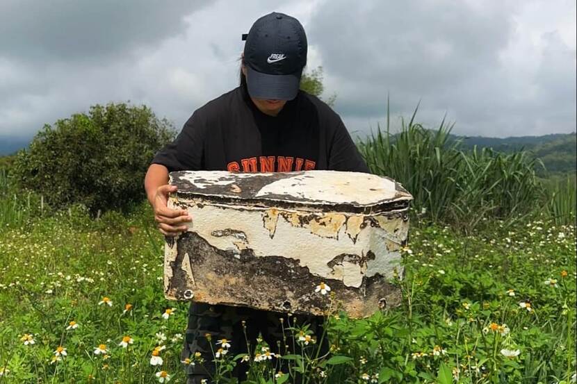 Dr. Jirawan Kumsao with her biodegradable pet coffin made from mushroom mycelium and agricultural residues