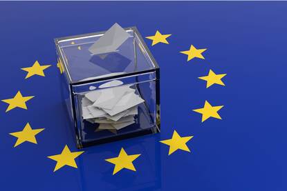 The concept of the election of the European Parliament. Voting box on EU flag background.