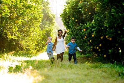 ZA Organic citrus farm, children running